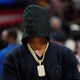 National Football League wide receiver Antonio Brown poses with a hood on at an NBA basketball game between the Los Angeles Clippers and the Golden State Warriors Monday, Feb. 14, 2022, in Los Angeles.